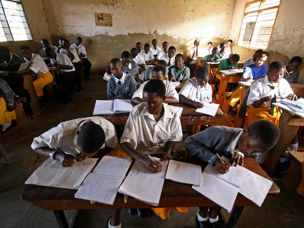 Moving on up: Secondary school pupils in Uganda, which has extended free education in recent years