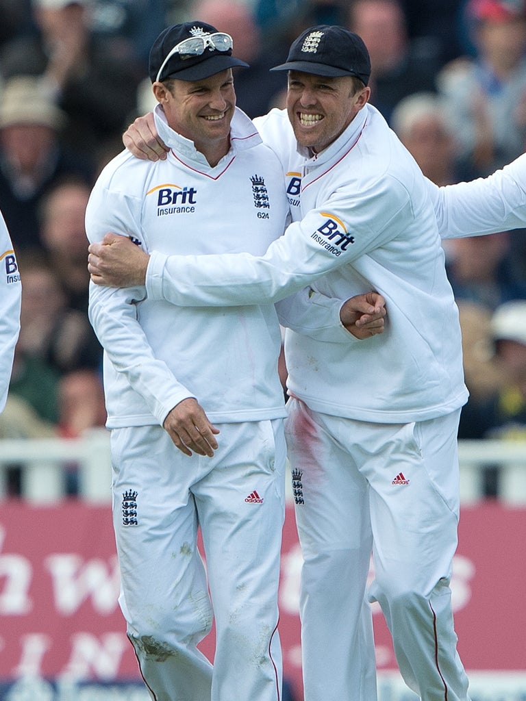 Andrew Strauss celebrates with Graeme Swann after catching out West Indies' Darren Sammy