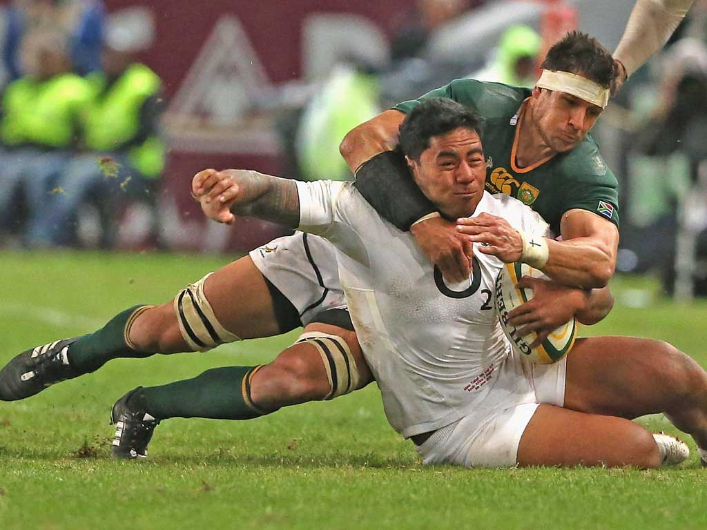 Manu Tuilagi is flattened by Pierre Spies