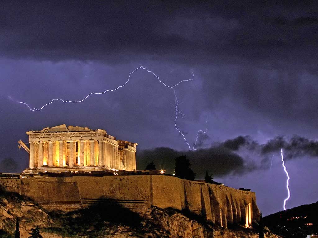 The Parthenon temple, on the Acropolis hill in Athens, is framed by lightning bolts