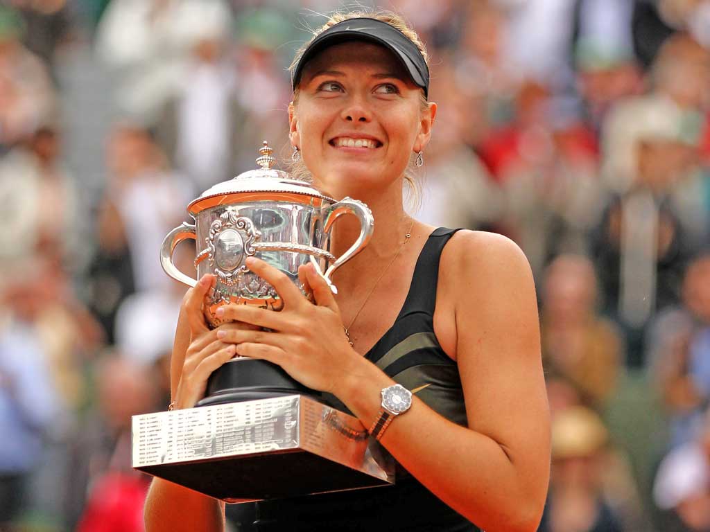 A happy Maria Sharapova holds the Coupe Suzanne Lenglen