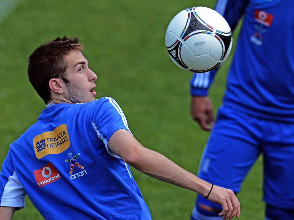 Greece’s Kostas Fortounis keeps his eye on the ball during training yesterday