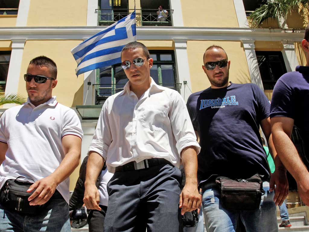 Ilias Kasidiaris, of the far-right Golden Dawn party, leaves court in Athens yesterday
