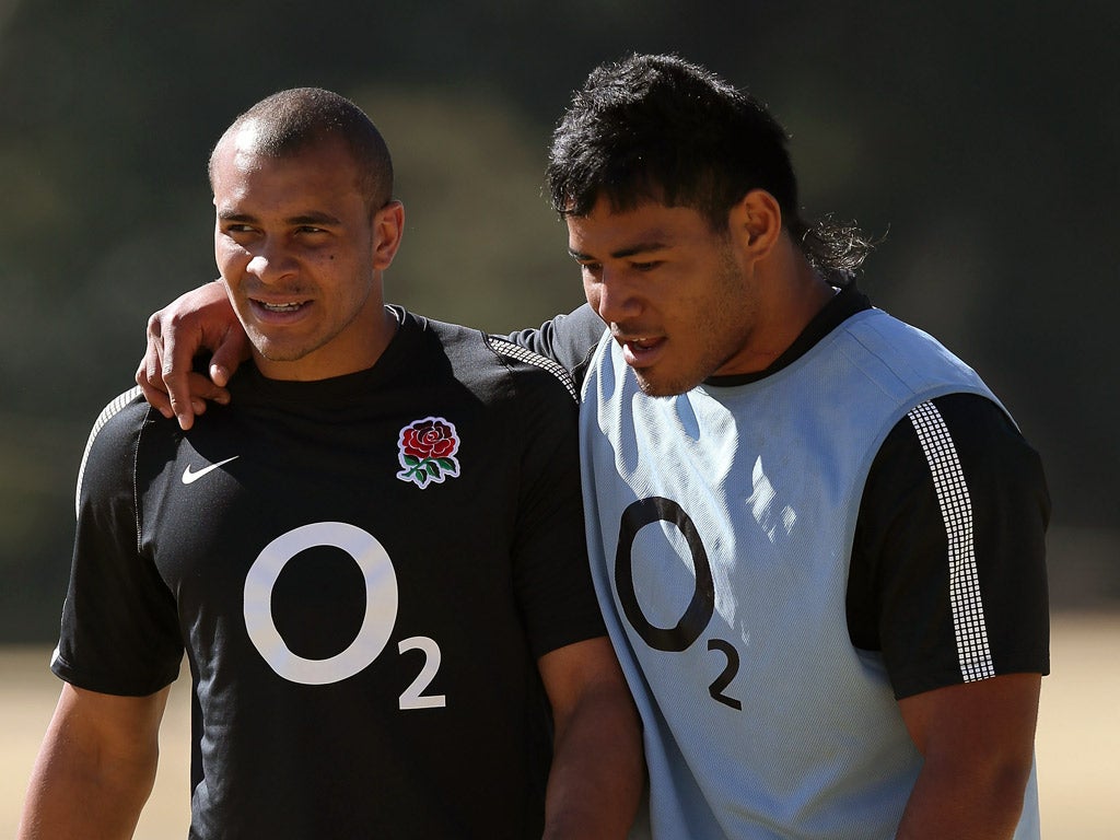 Jonathan Joseph (left) trains with fellow centre Manu Tuilagi yesterday