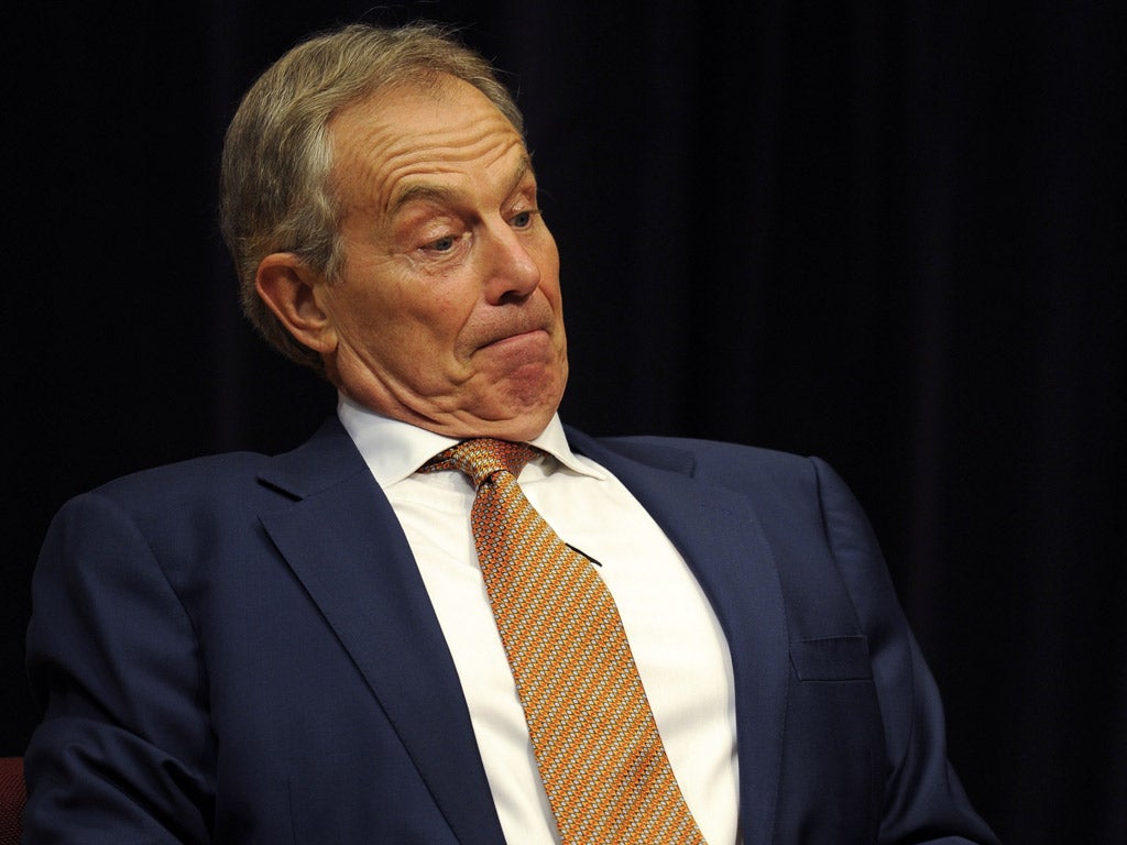 Former Prime Minister Tony Blair appears flustered at the prospect of a possible citizen’s arrest at the hands of protester Tom Grundy