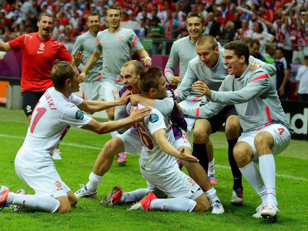 Jakub Blaszczykowski of Poland celebrates scoring