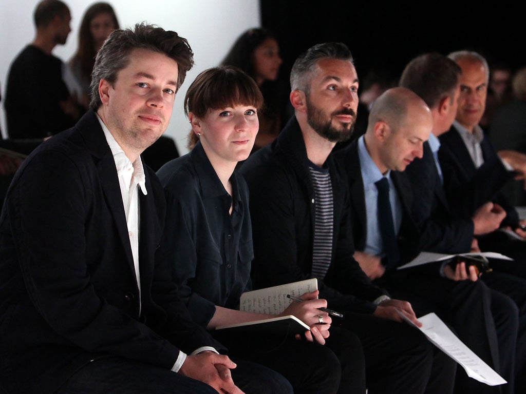 Tim Walker (left) and Harriet Walker watch the runway