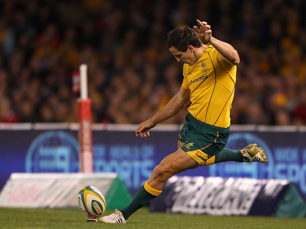 Wallaby Mike Harris kicks the winning penalty