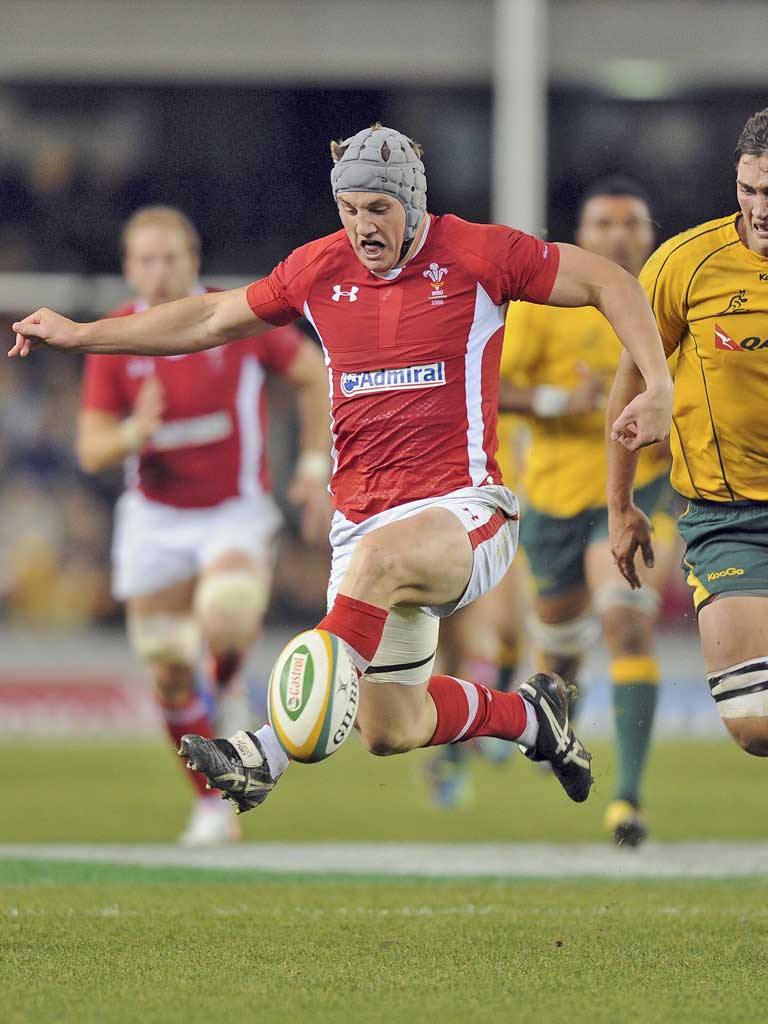 Wales' Jonathan Davies kicks ahead, but his team ended behind