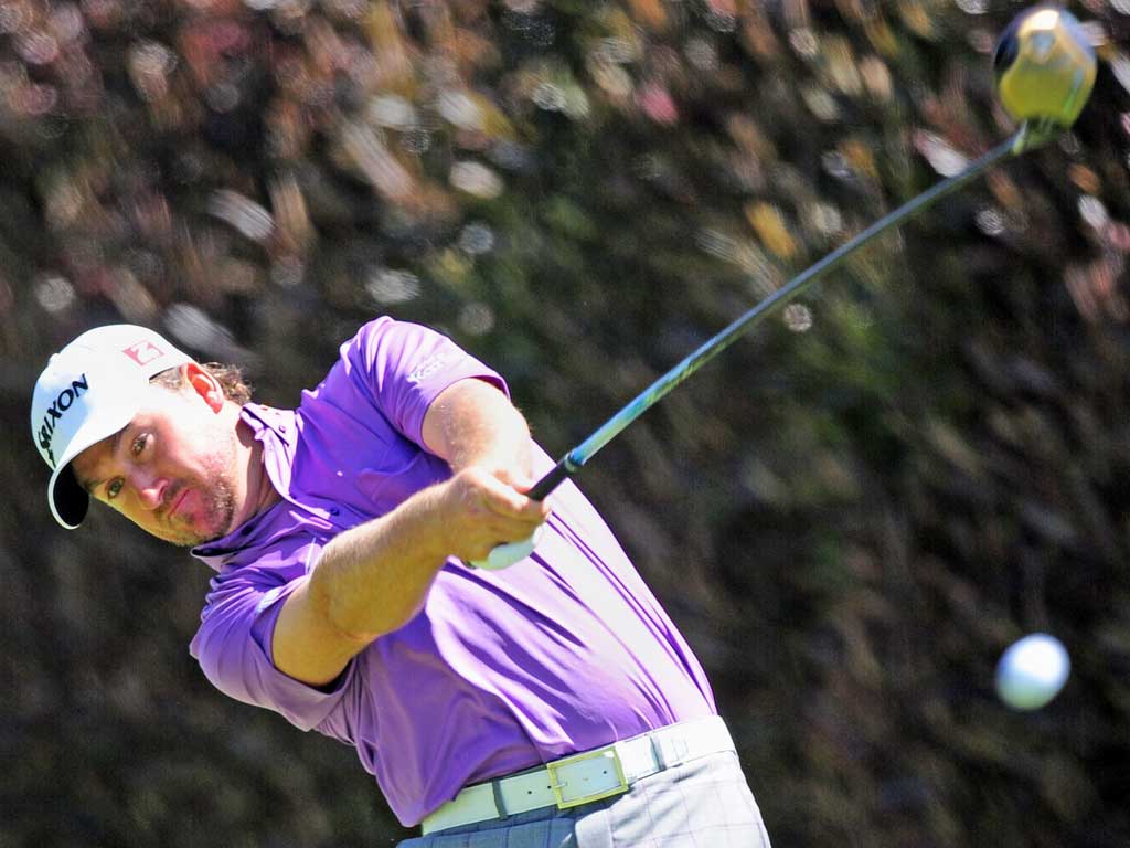 Graeme McDowell of Northern Ireland tees off during the third
round