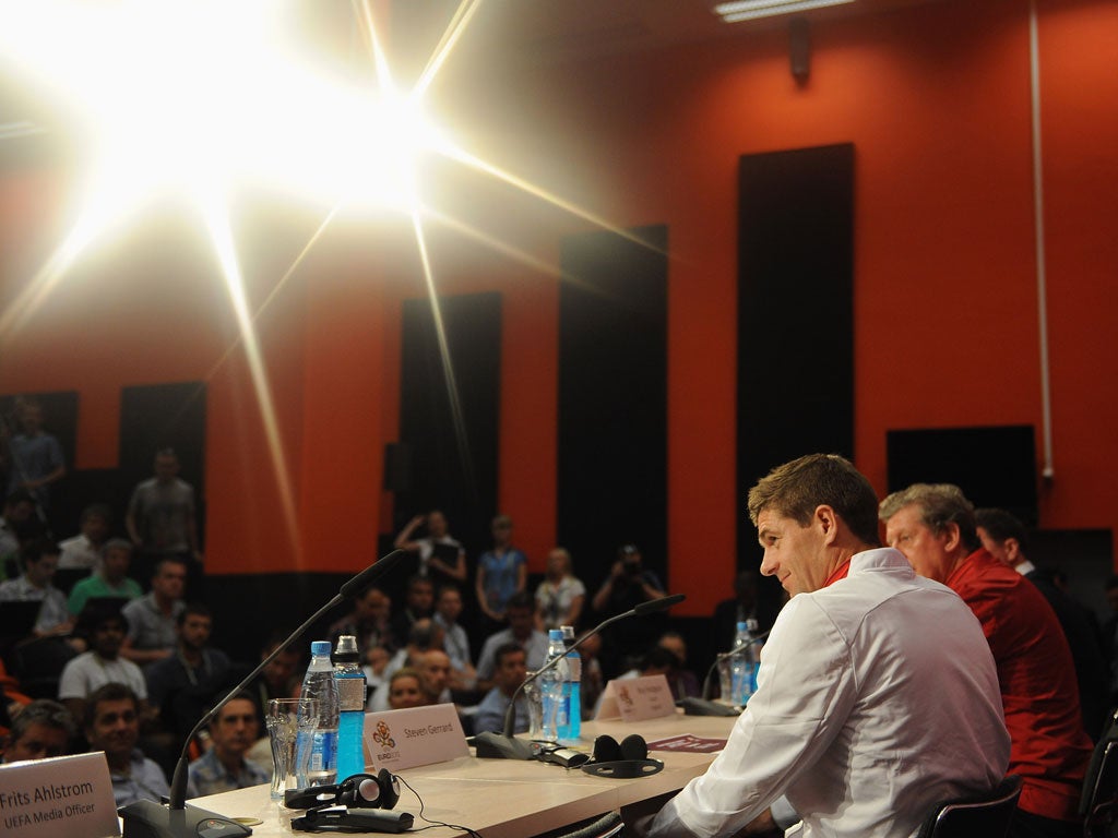 Roy Hodgson and Steven Gerrard face the press