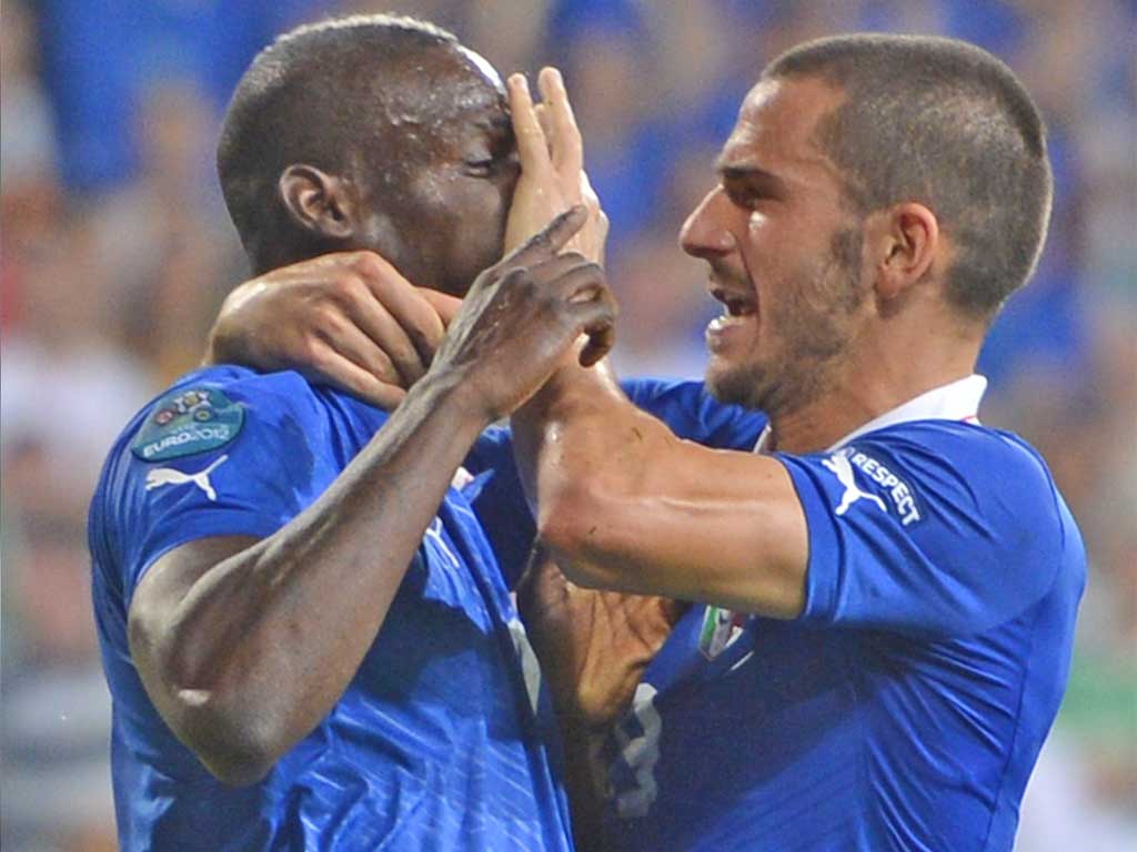 Mario Balotelli is silenced by his Italian team-mate Leonardo Bonucci after scoring