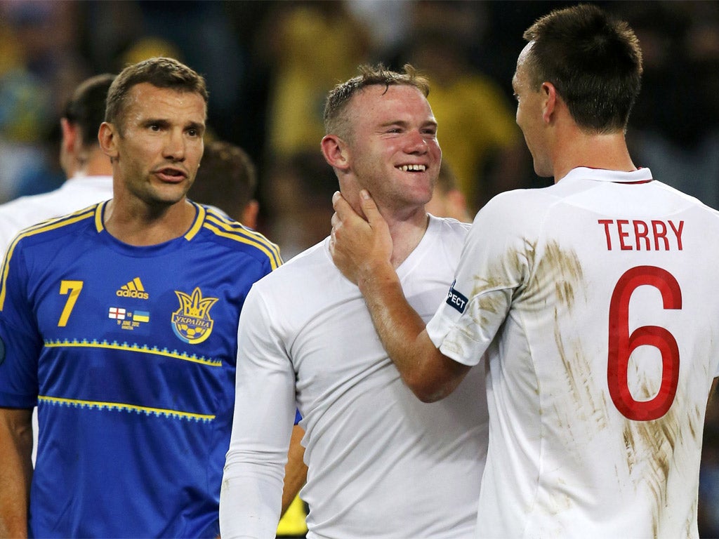 Wayne Rooney celebrates with John Terry as Andrei Shevchenko looks on