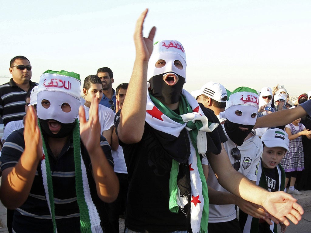 People shout slogans in support of Colonel Hassan Hamada in Amman,Jordan, yesterday