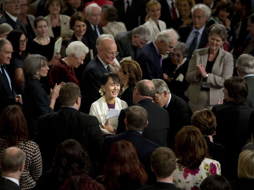 Aung San Suu Kyi mingles with MPs and peers after addressing both Houses of Parliament at Westminster Hall