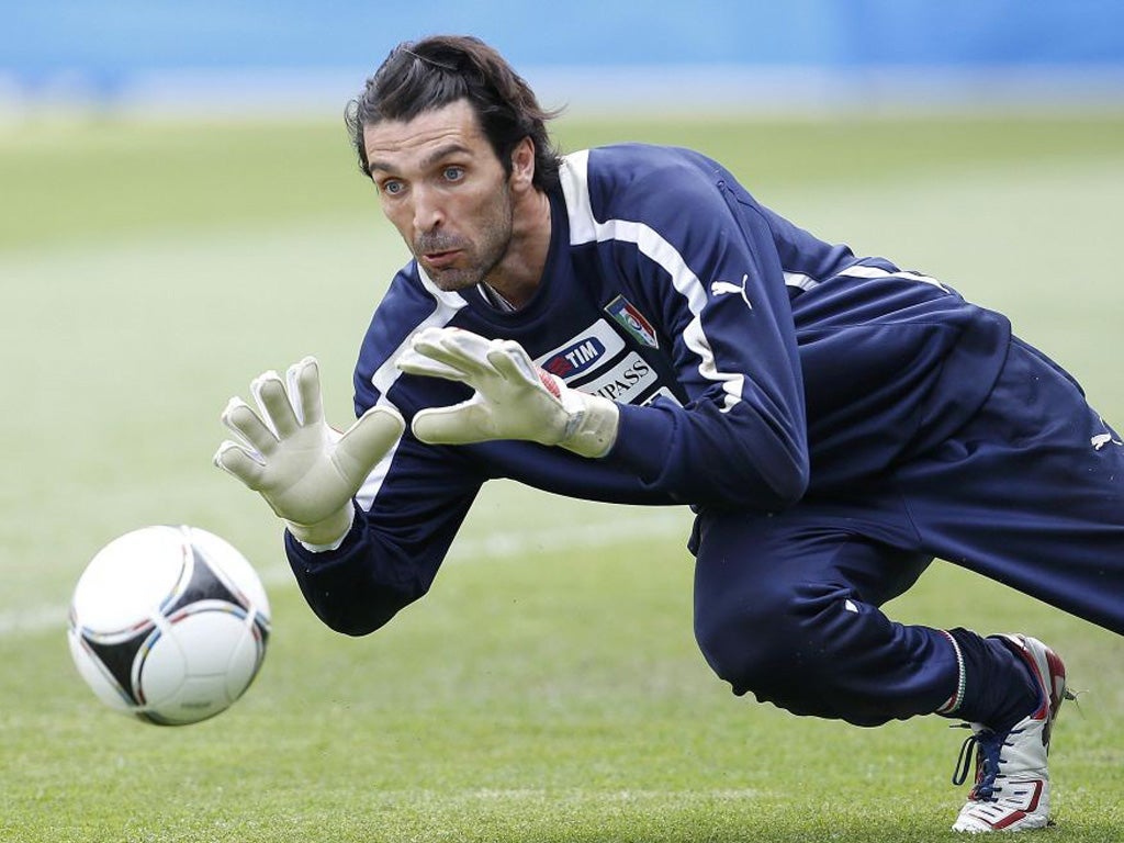 Italy's Gianluigi Buffon shows his handling skills in training