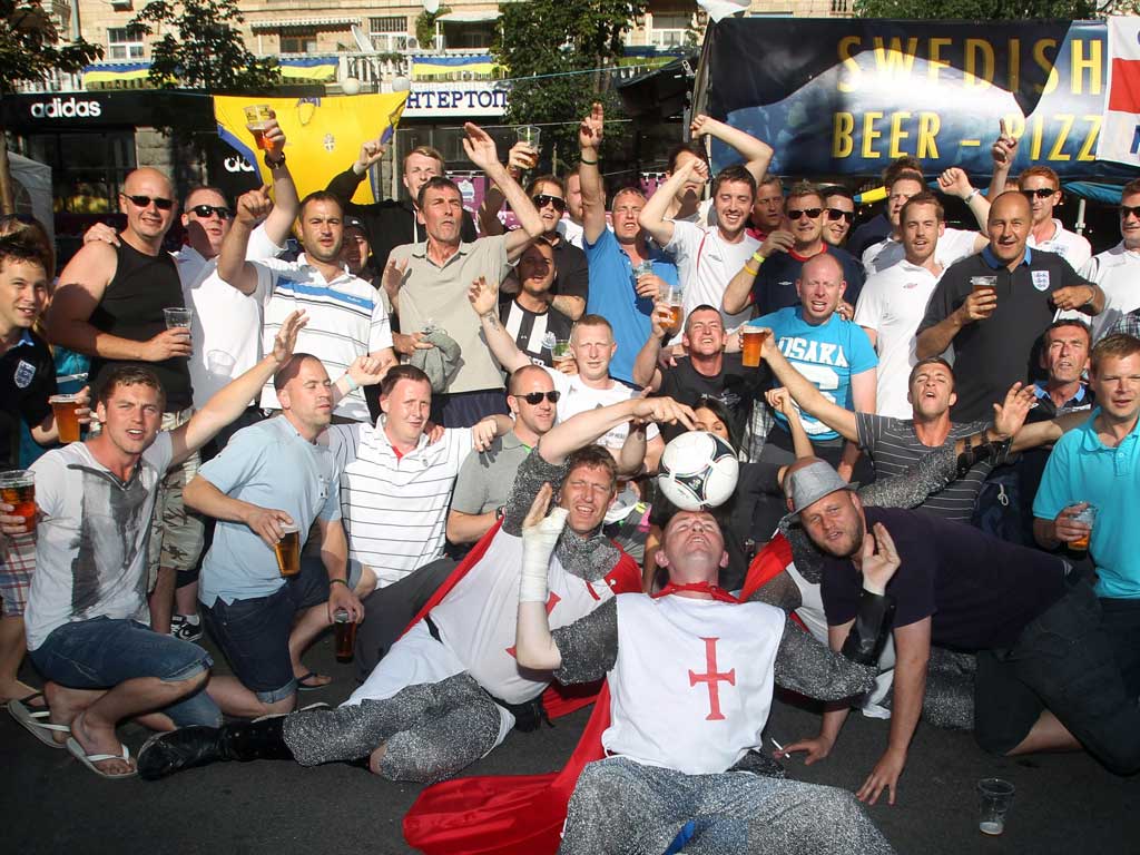 England fans
enjoy the sun in
Kiev yesterday