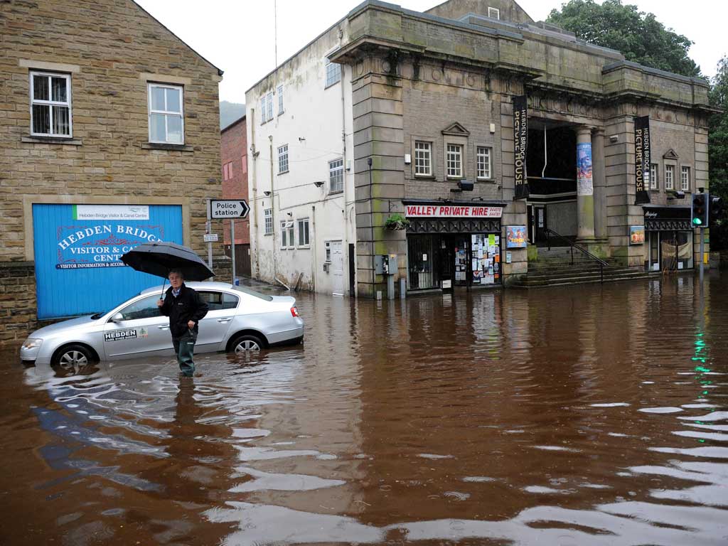 High tide: Hebden Bridge under water yesterday