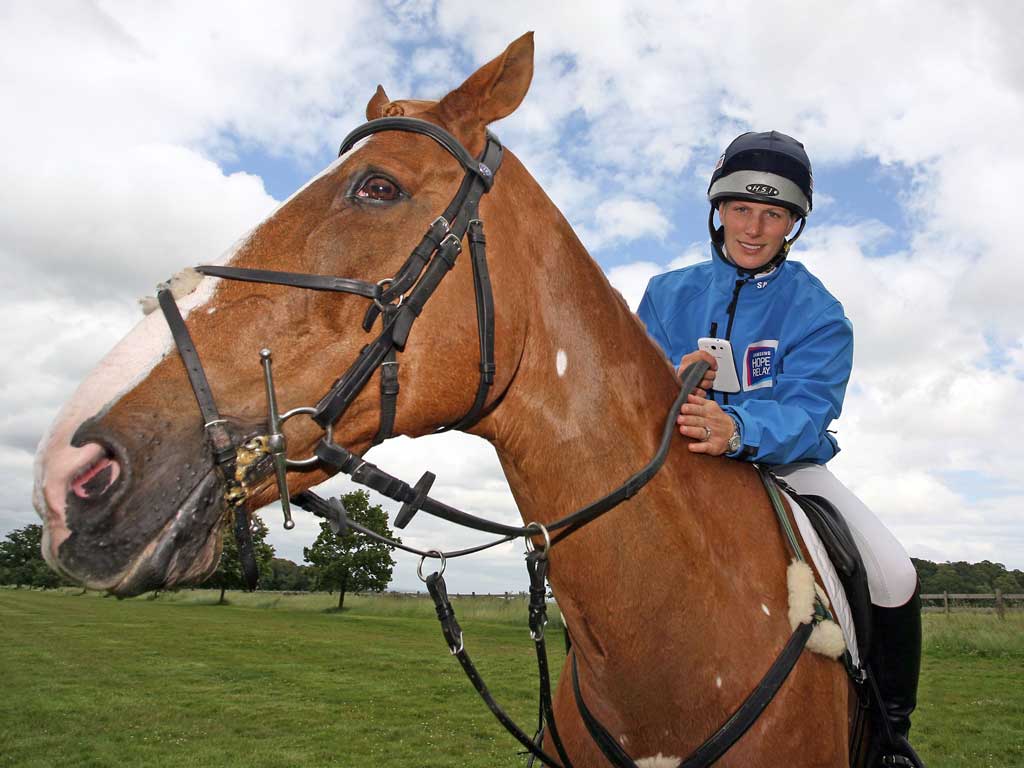 Zara Phillips, phone in hand, on Toytown, who won’t be joining her at the Olympics