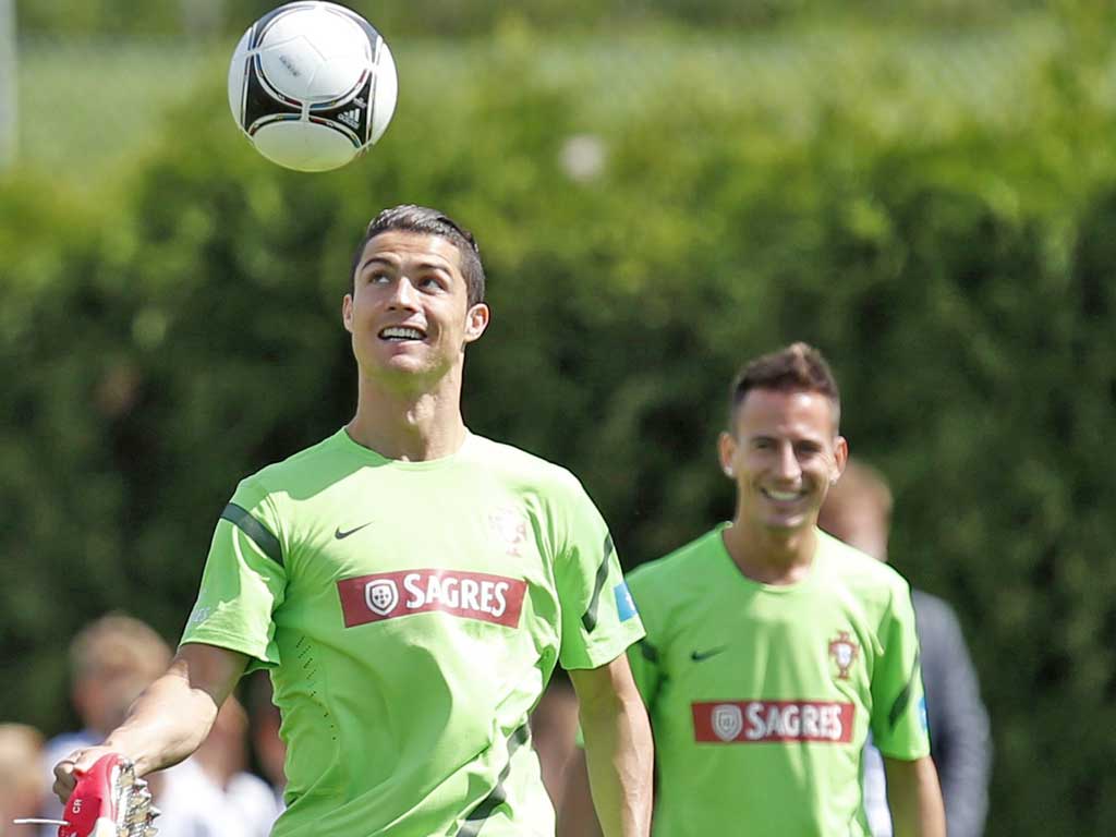 Joao Pereira (right) keeps an eye on Cristiano Ronaldo during Portugal training