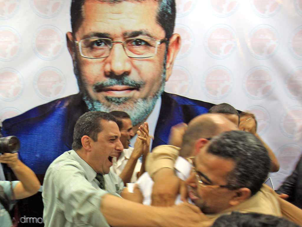 Muslim Brotherhood supporters celebrate Mr Morsi’s victory