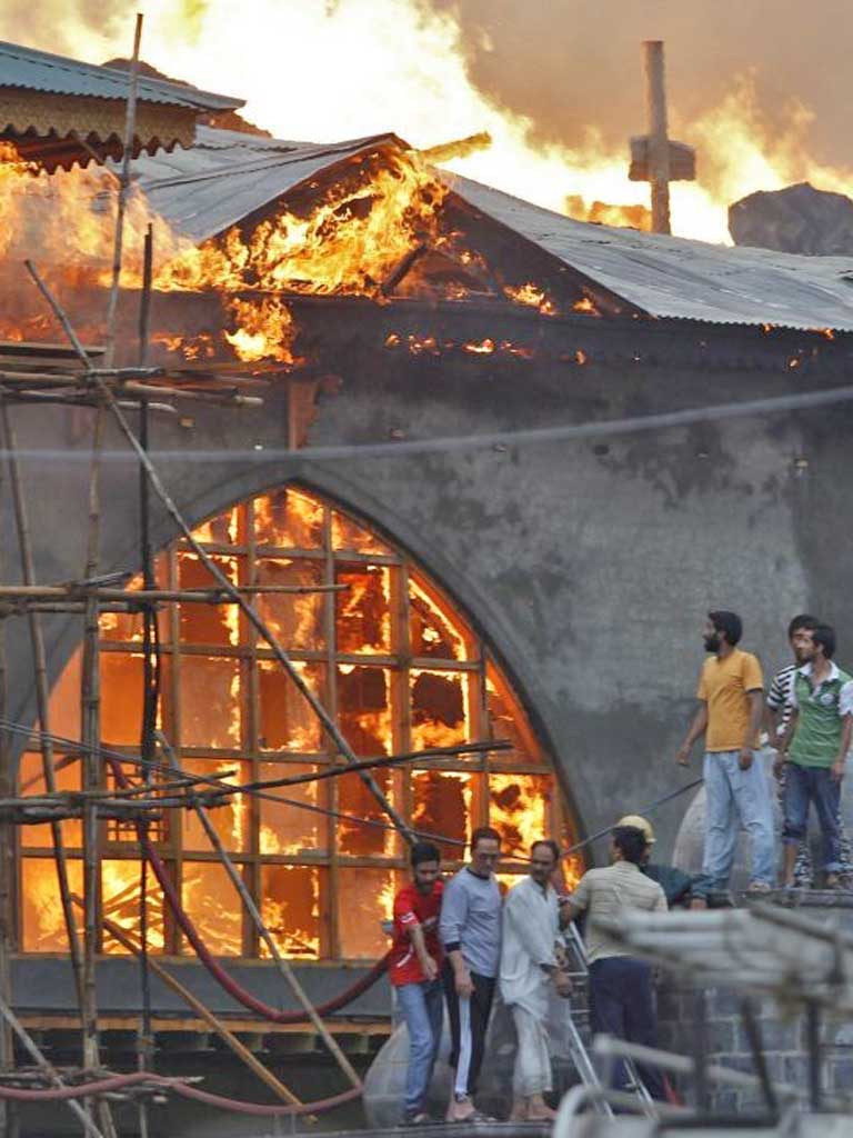 Fire destroyed a Muslim shrine in Indian-administered Kashmir yesterday