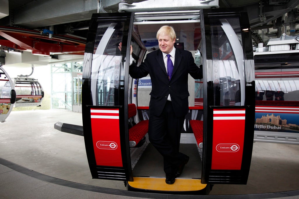 Boris Johnson, The Mayor of London, poses for a photograph at the doors of a cabin of the new Emirates Cable Car in London, Britain, 28 June 2012. The new 70 million euro London's cable car system is the first urban cable car system of its kind in Britain