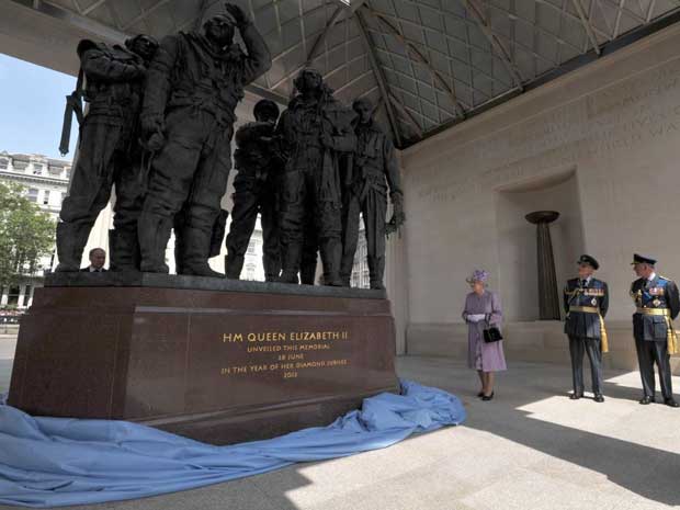 The Queen unveils the Bomber Command Memorial in Green Park, London, watched by the Duke of Edinburgh and the Prince of Wales