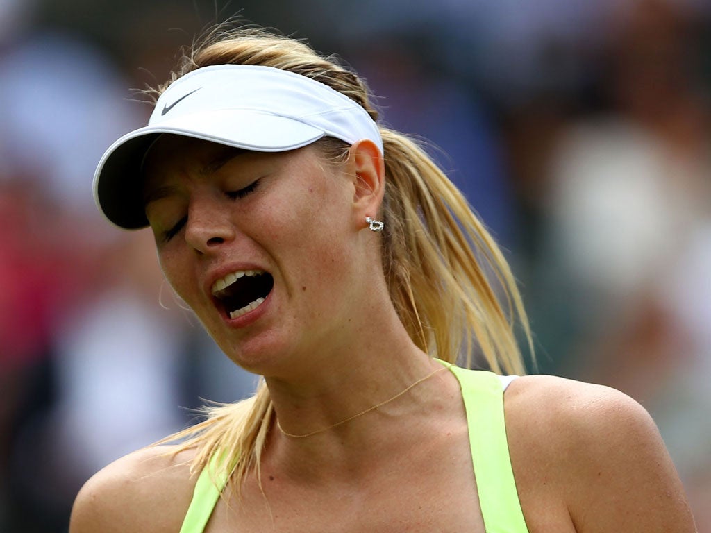 Maria
Sharapova:
The world No 1's
serve fell apart in
the second-set
tie-break against
Pironkova