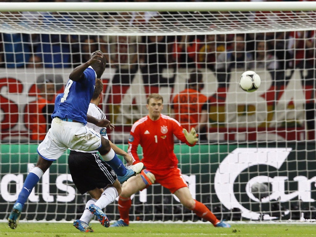 Mario Balotelli wallops
his second past a helpless
Manuel Neuer