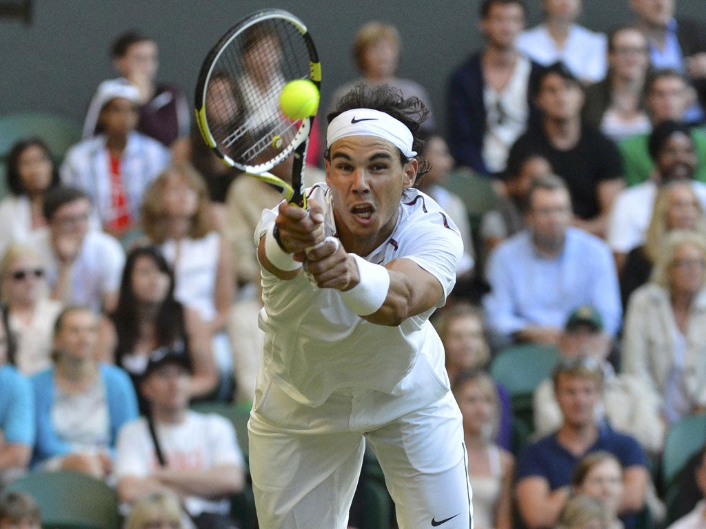 Rafa Nadal at full
stretch during
his stunning
defeat