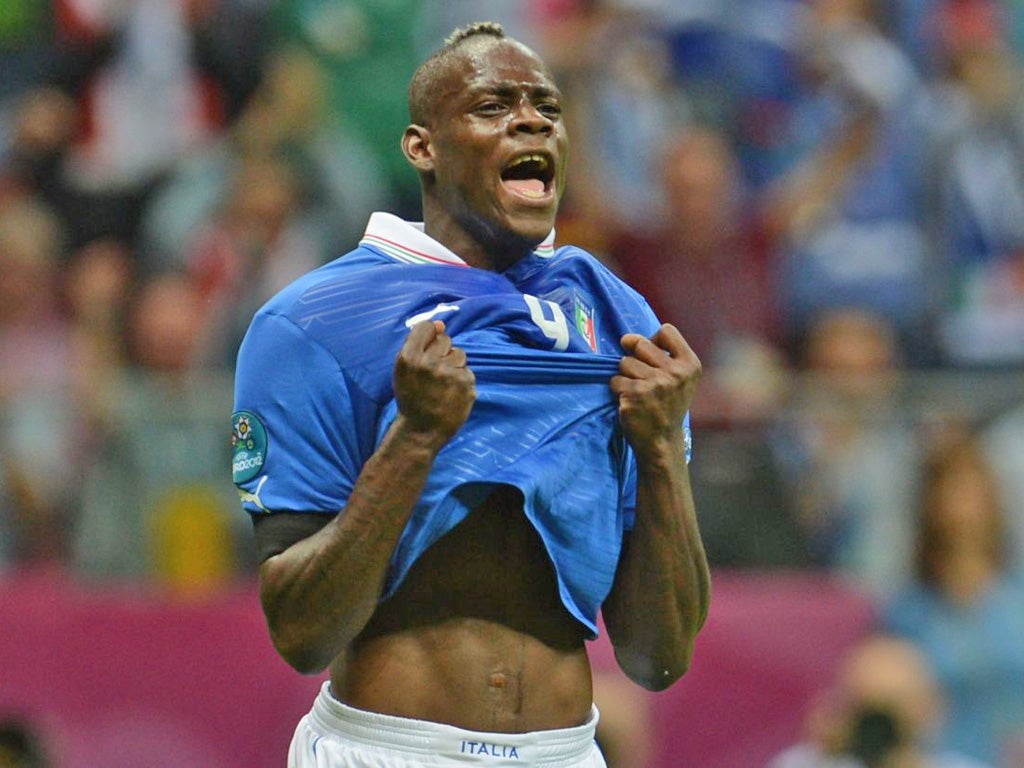 Mario Balotelli celebrates his strike defiantly