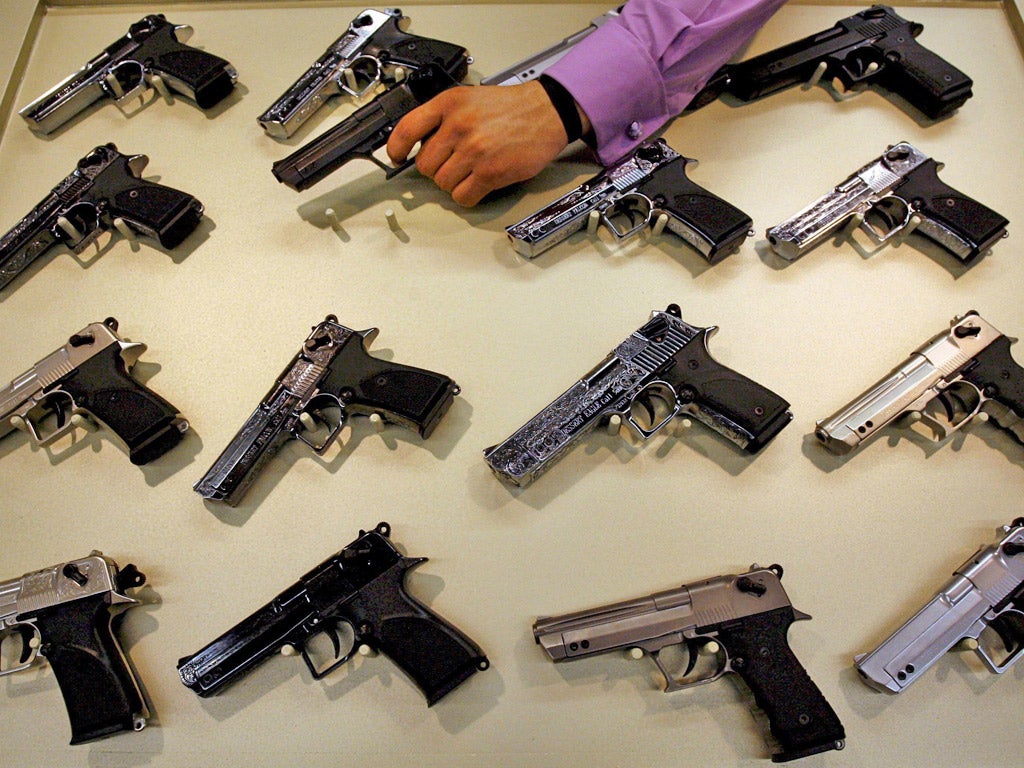 Guns for sale at a trade fair in Nuremberg, Germany, with 1,050
exhibitors from 51 countries