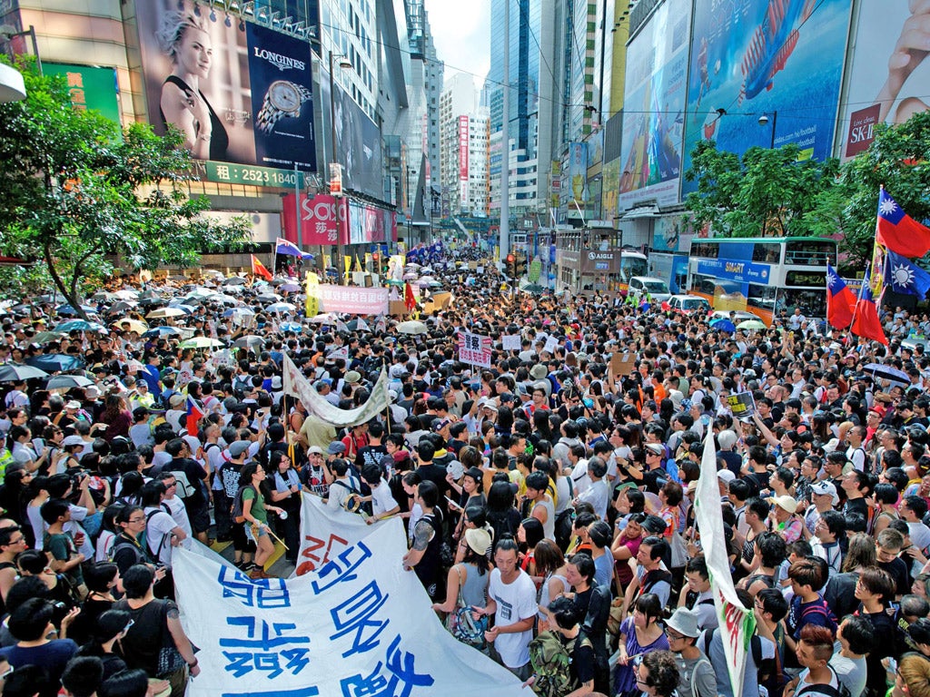 More than 100,000 residents took the streets yesterday to protest against Chinese rule on the 15th anniversary of the former British colony’s return to Beijing