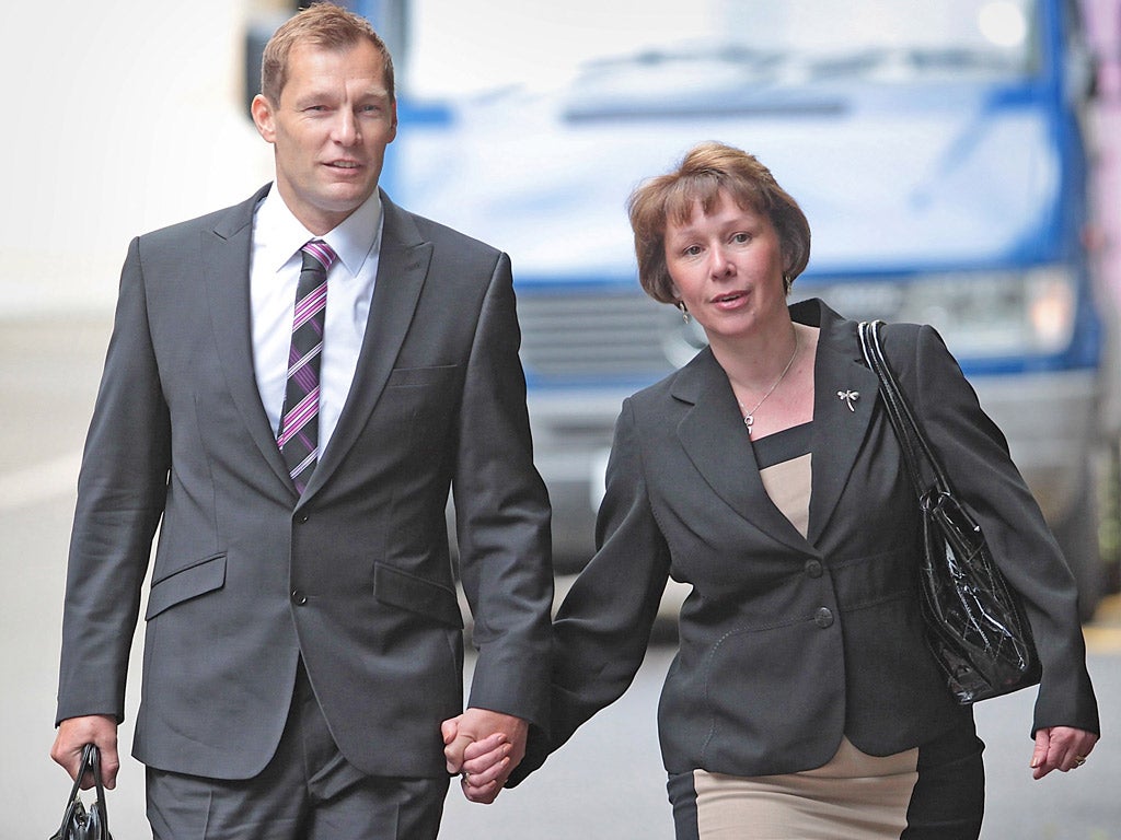 PC Simon Harwood in court with his wife Helen