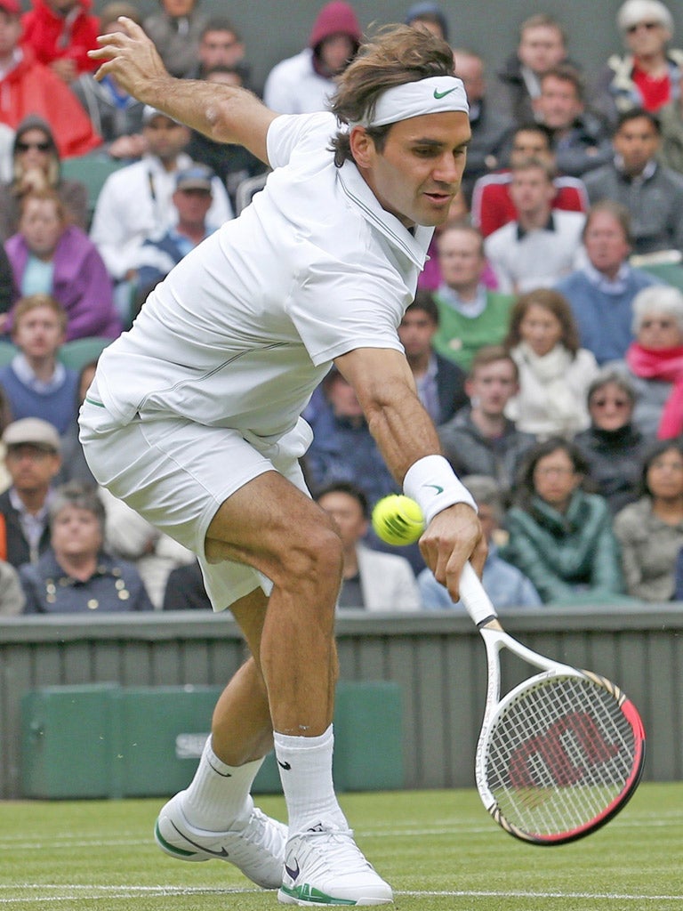 Roger Federer reaches for a return during his win yesterday