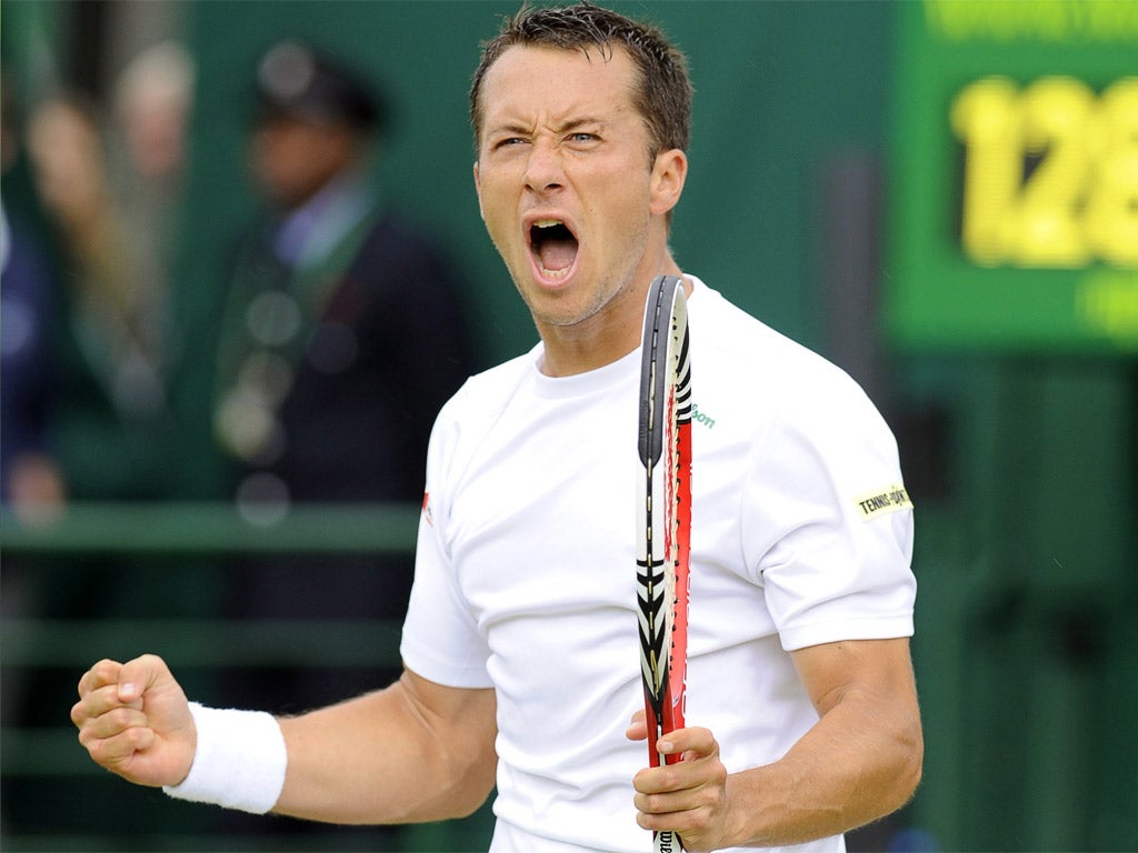 Philipp Kohlschreiber celebrates reaching the quarter-finals