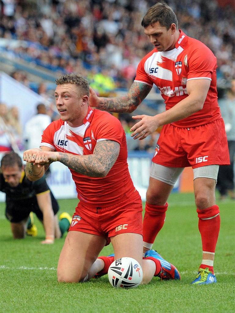 Josh Charnley (left) celebrates scoring for England