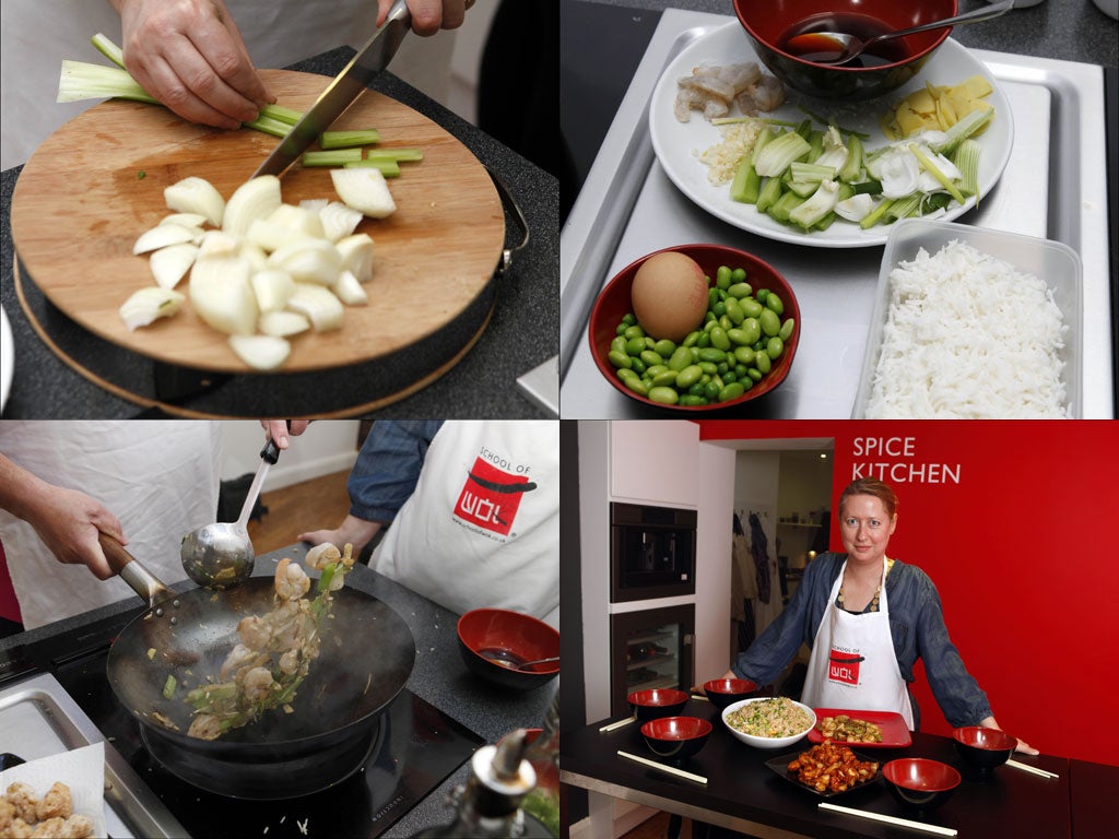 Orient express: Lisa Markwell (bottom right) learns to make delicious Chinese dishes in a flash at the School of Wok