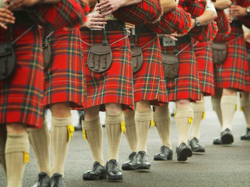 EDINBURGH, SCOTLAND - AUGUST 4: Scottish pipers take to the parade ground at Redford Barracks on August 4, 2004 in Edinburgh, Scotland. Military Bands and performers from around the world braved the Scottish rain and gathered for a final rehearsal of the forthcoming 55th Edinburgh Military Tattoo.