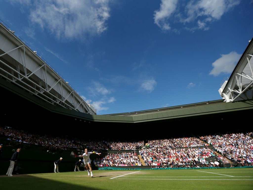Murray in action in front of a packed Centre Court