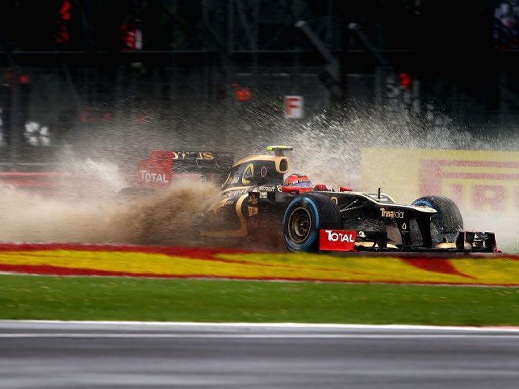 Vitaly Petrov tackles the wet during practice at Silverstone yesterday