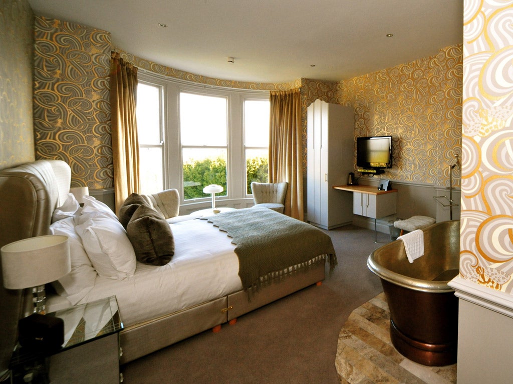 Escape's Contemorary Deco room is deocrated inlustrous hues