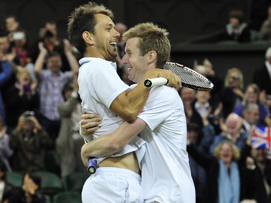 Happily Marray-ed: Jonathan Marray (right) hugs his partner Frederik Nielsen after winning the men's doubles