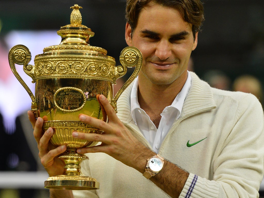 Federer with the trophy after his men's singles final victory over Andy Murray