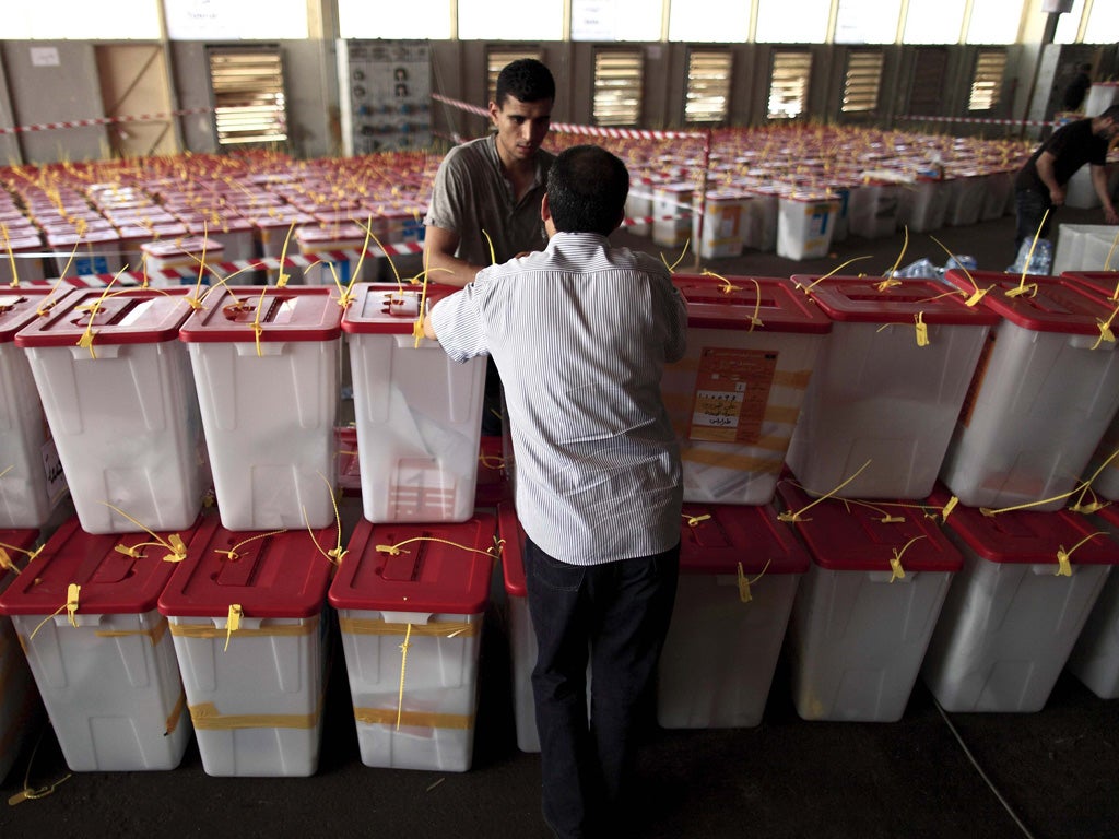 Ballot boxes arrive at Maatiga airport in Tripoli for counting