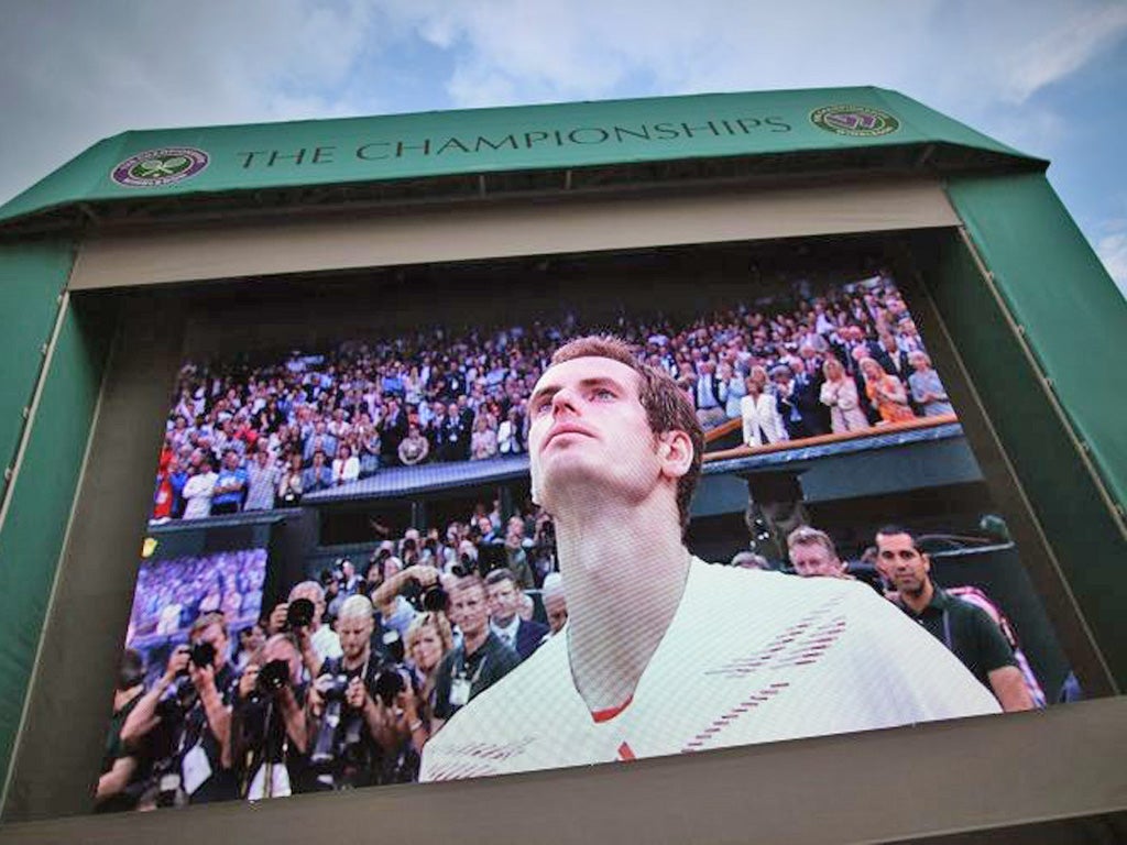 A tearful Andy Murray appears on a big screen at SW19
