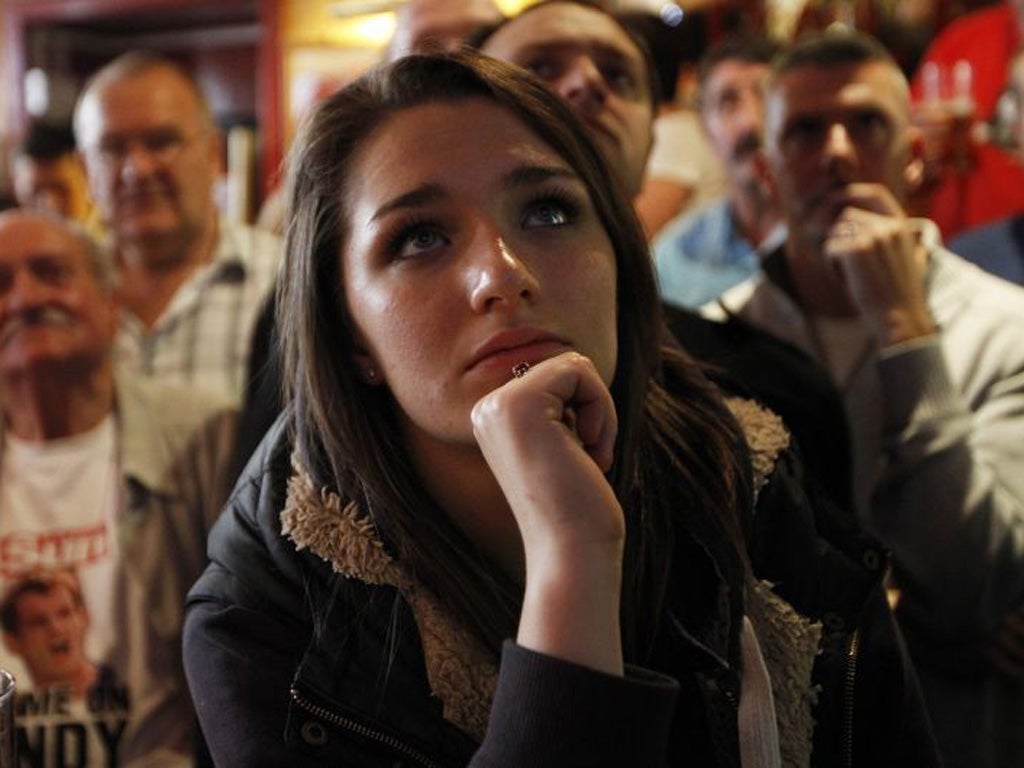 Murray fans watch the match in a pub in his home town