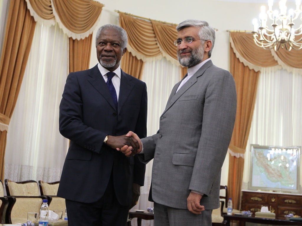 UN and Arab League envoy for the crisis in Syria, Kofi Annan (L) with Iran's chief nuclear negotiator Saeed Jalili in Tehran today