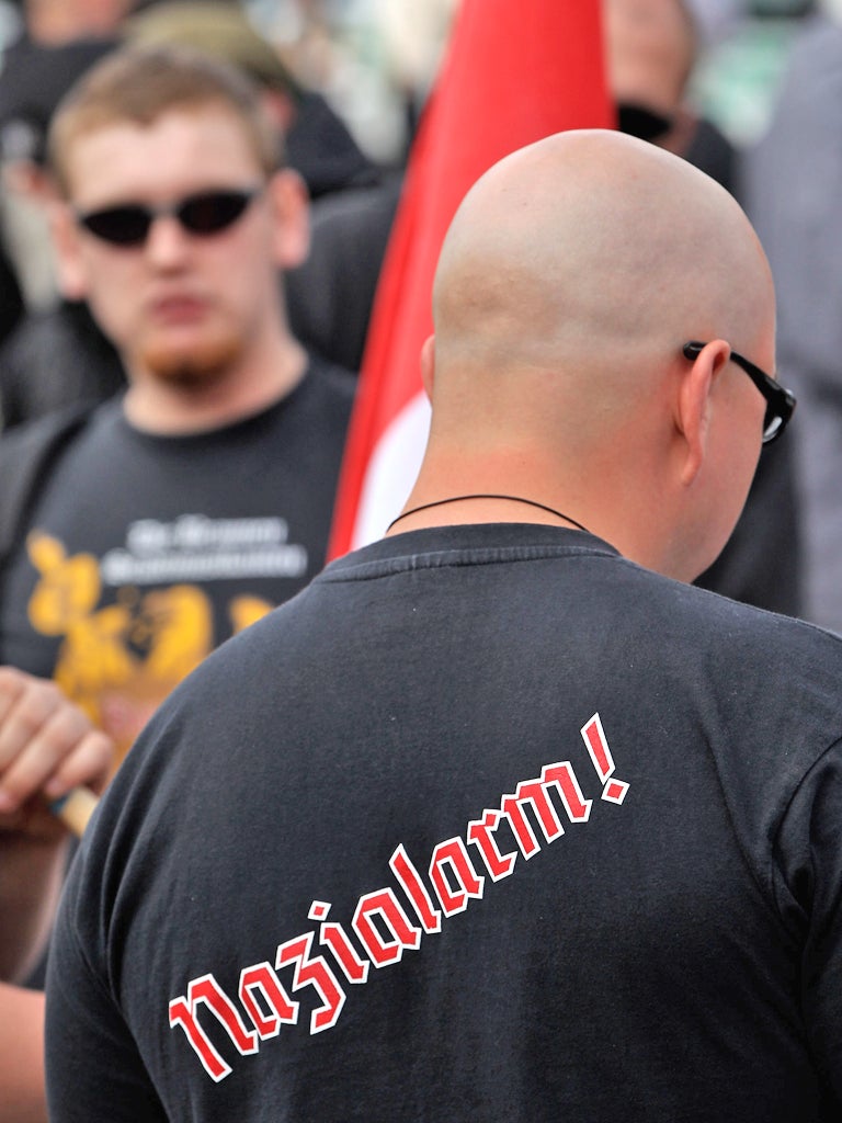 A Neo-Nazi supporter with a t-shirt that reads: 'Nazi Alarm!'